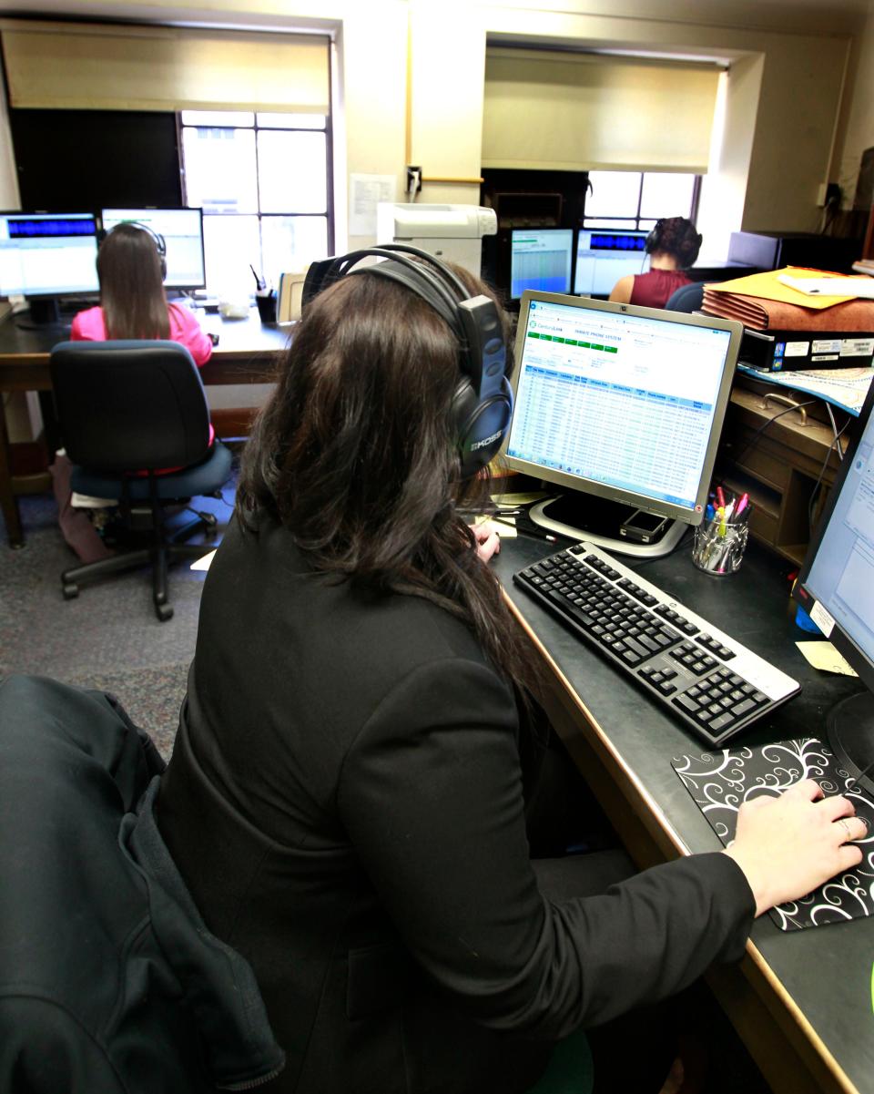 Employees in the District Attorney's Office listen to jail calls in 2015.