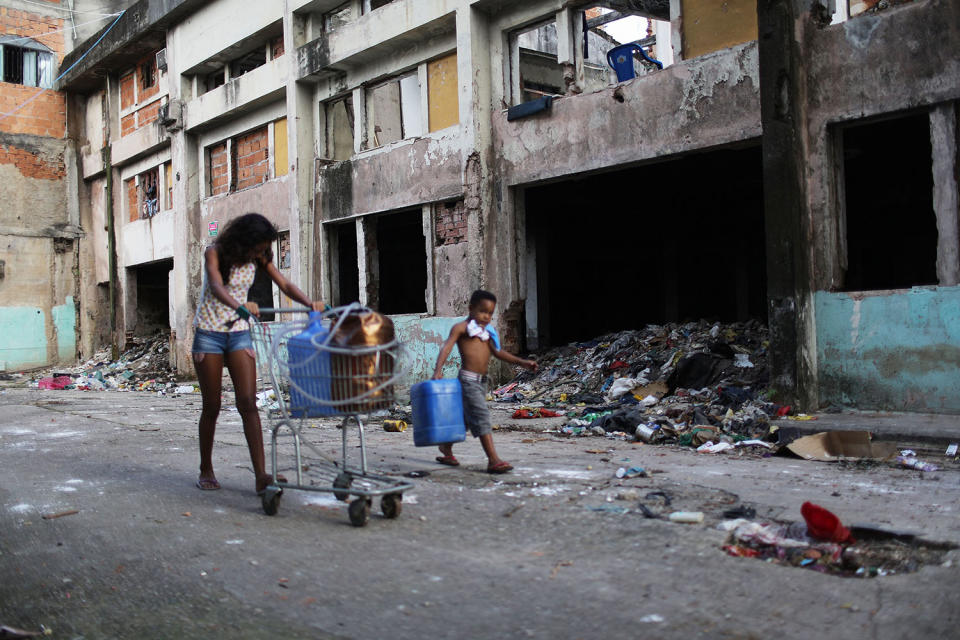 Young people hauling water back home