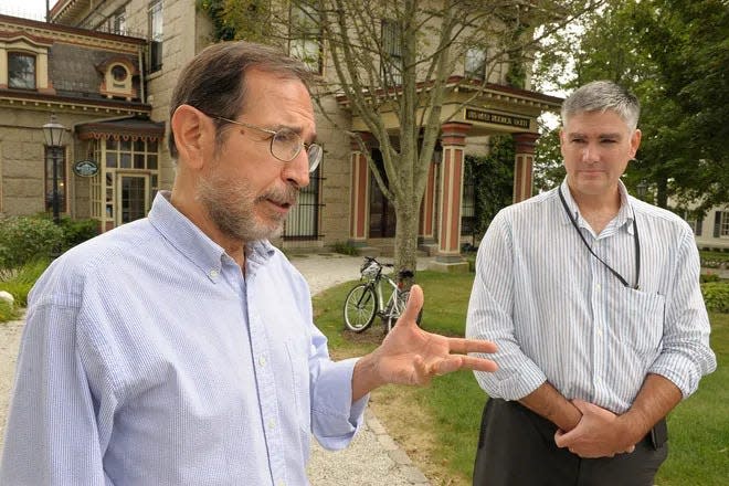 Historian, urban planner and activist Al Lima, left, stands in front of the Fall River Historical Society with Preservation Society of Fall River President Jim Soule in this file photo.