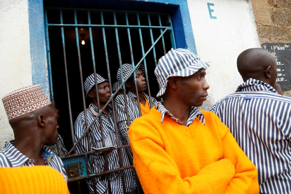 <p>Kenyan prisoners watch a mock World Cup soccer match between Russia and Saudi Arabia as part of a soccer tournament involving eight prison teams at the Kamiti Maximum Security Prison, Kenya’s largest prison facility, near Nairobi, on June 14, 2018. (Photo: Baz Ratner/Reuters) </p>