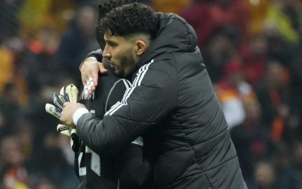 Manchester United reserve goalkeeper Altay Bayindir consoles Andre Onana at the final whistle in Istanbul