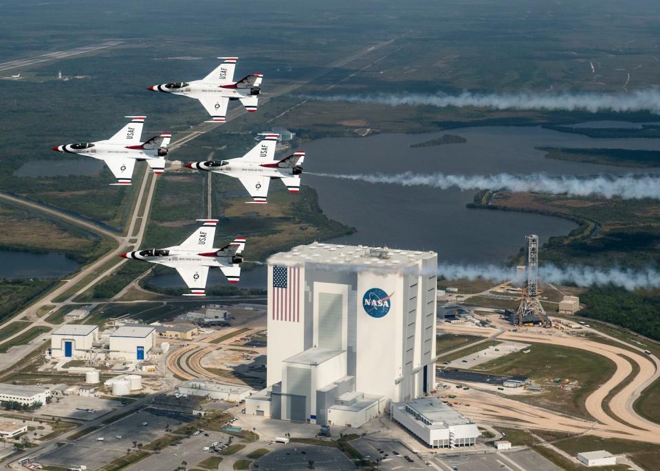 President Donald Trump wants a new Space Force branch of the U.S. military, but it reopens an old argument about military uses in space. Here, the U.S. Air Force Thunderbirds fly over NASA's Kennedy Space Center in Florida with retired NASA astronaut and Air Force Col. Buzz Aldrin. <cite>U.S. Air Force photo/Tech. Sgt. Christopher Boitz</cite>