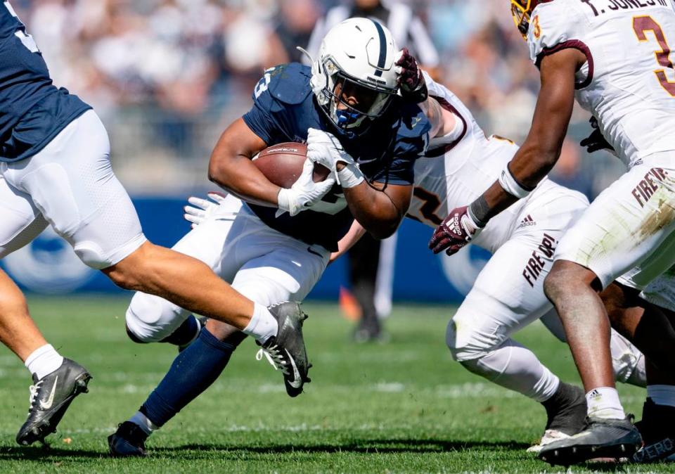 Penn State running back Kaytron Allen cuts through Central Michigan defenders with the ball during the game on Saturday, Sept. 24, 2022.