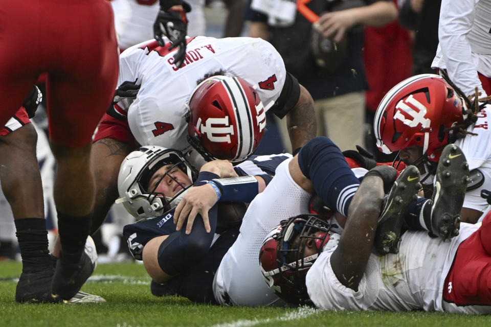 Indiana linebacker Anthony Jones (4) sacks Penn State quarterback Drew Allar (15) during the first half of an NCAA college football game, Saturday, Oct. 28, 2023, in State College, Pa. (AP Photo/Barry Reeger)