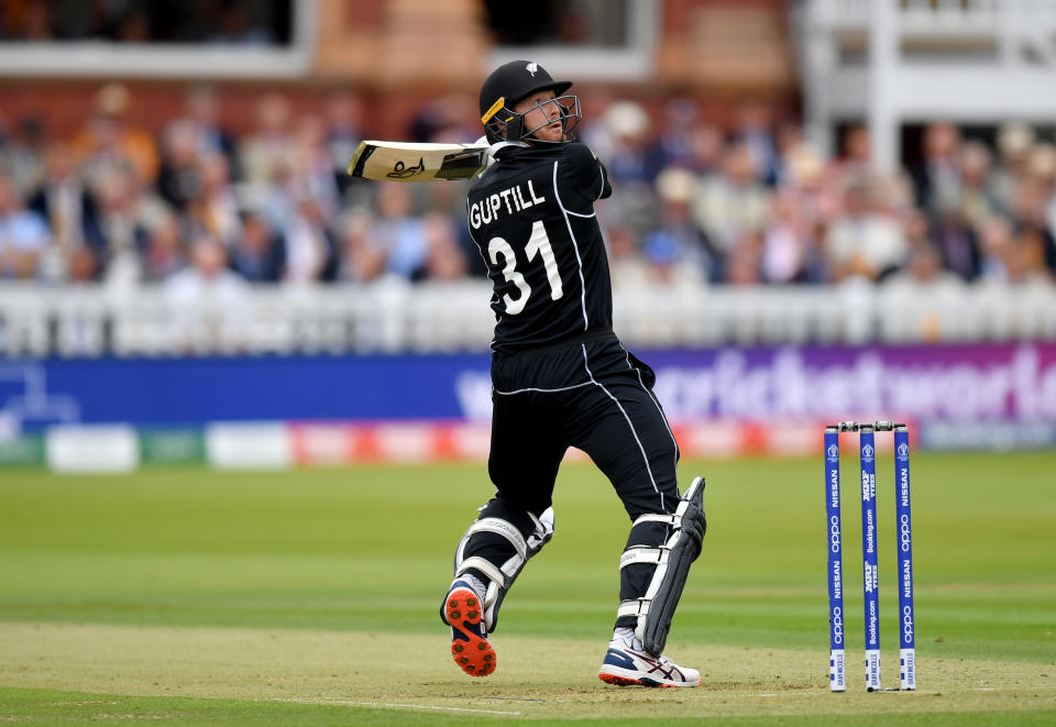 Martin Guptill smashes a six in the opening overs of the match. (Photo by Mike Hewitt/Getty Images)