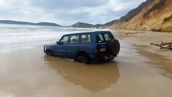 Sucked in: The Australian beach that 'swallows' cars