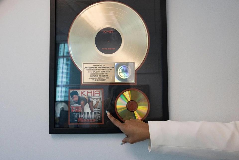 Lahteefah Parramore, CPA and founder of the LRW Group, points to a client record by Khia for 500,000 copies of “Thug Misses” in her office space on Wednesday, Feb. 14, 2024, in Brickell. The LRW Group is a business management firm specializing in the entertainment industry.