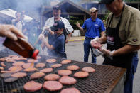 Kentucky Governor Andy Beshear, center, answers question from residents that have been displaced by floodwaters at Jenny Wiley State Resort Park Saturday, Aug. 6, 2022, in Prestonsburg, Ky. (AP Photo/Brynn Anderson)