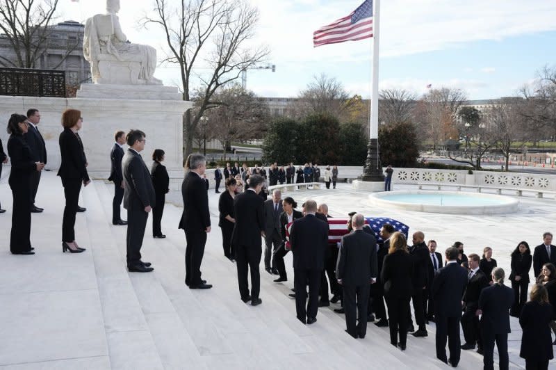 The flag-draped casket of retired Supreme Court Justice Sandra Day O'Connor arrives at the Supreme Court. Pool Photo by Alex Brandon/UPI