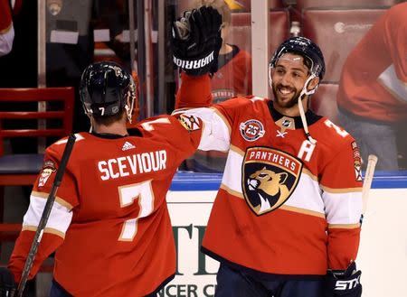 Jan 18, 2019; Sunrise, FL, USA; Florida Panthers center Vincent Trocheck (right) celebrates with center Colton Sceviour (left) after defeating the Toronto Maple Leafs during the third period at BB&T Center. Mandatory Credit: Steve Mitchell-USA TODAY Sports