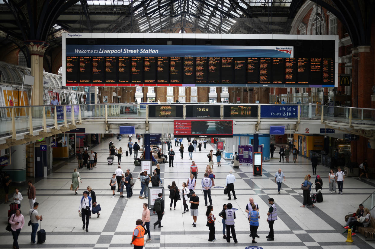 People walk through Liverpool Street station. Rail strikes had an impact on the UK economy
