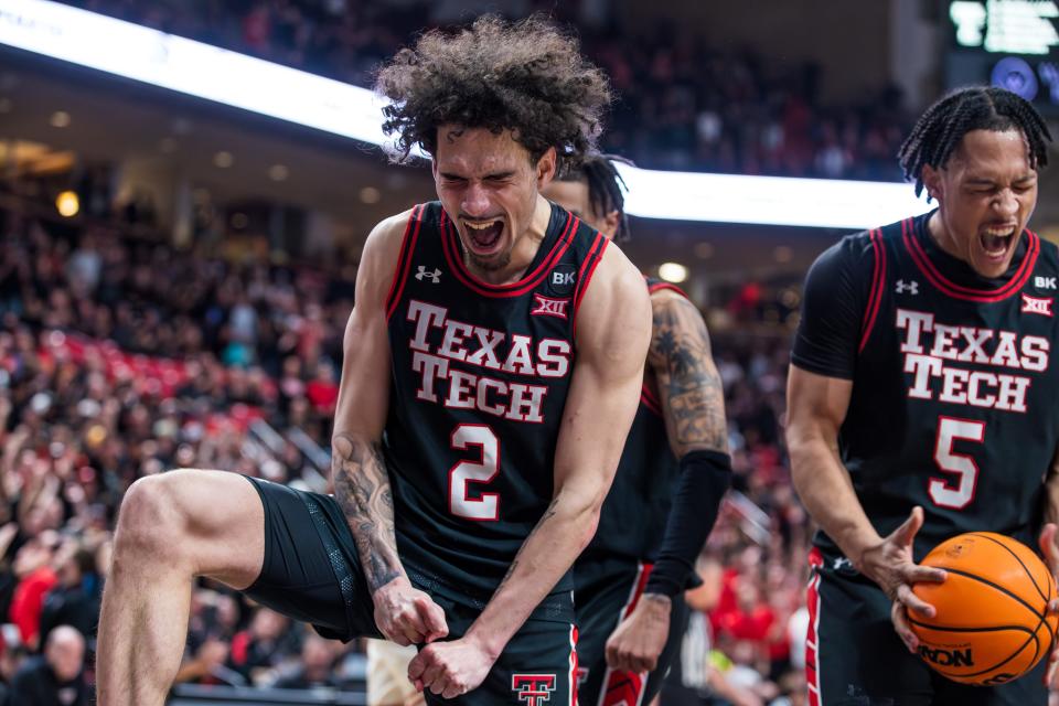 Pop Isaacs and Darrion Williams #5 of Texas Tech react during the second half of the game against the Texas Longhorns at United Supermarkets Arena on Tuesday, February 27, 2024 in Lubbock, Texas.