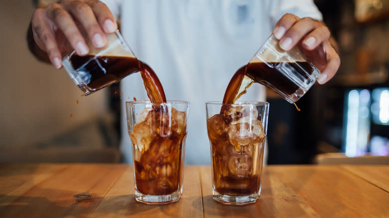 barista pouring cold brew coffee