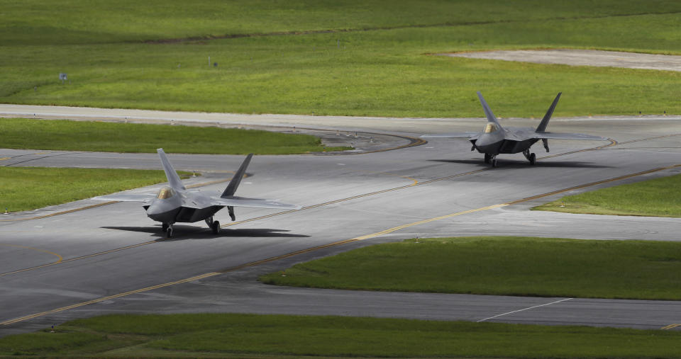 In this Aug. 14, 2012 photo, two U.S. Air Force F-22 Raptor stealth fighters taxi before take-off at Kadena Air Base on the southern island of Okinawa in Japan. The U.S. is hoping a dozen F-22 stealth fighters now roaring through the skies of southern Japan will prove its most prized combat aircraft is finally ready to resume full operations after years of investigations into why its pilots were getting dizzy and disoriented. But questions remain over whether the Air Force has taken enough action to fix a potentially bigger problem - the shriveling of programs to test cockpit life support systems after nearly 20 years of budget cuts, downsizing and outsourcing. (AP Photo/Greg Baker)