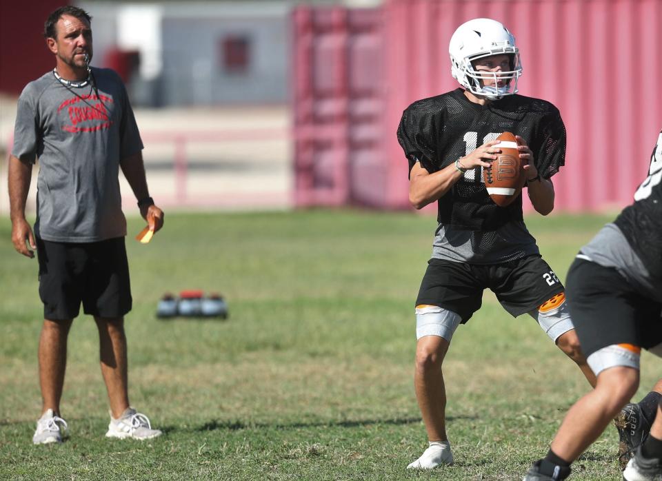 Christoval High School head football coach Casey Otho watches the Cougars as quarterback Kyle Abilez drops back to pass during practice on Wednesday, Aug. 3, 2022.