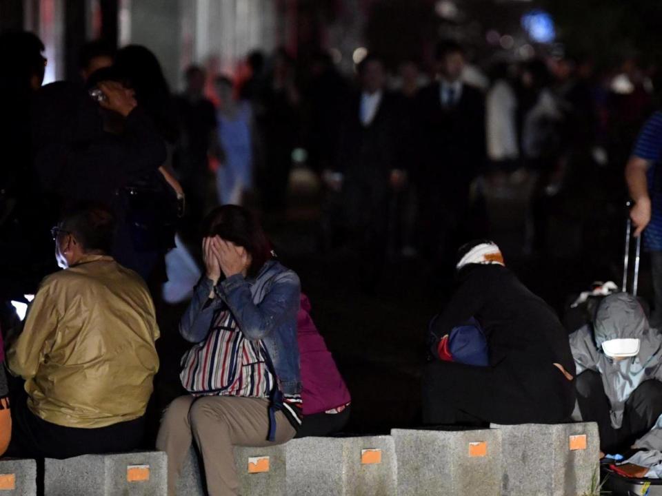 People react during blackout after a powerful earthquake hit the area in Sapporo, Japan (Kyodo/via REUTERS)