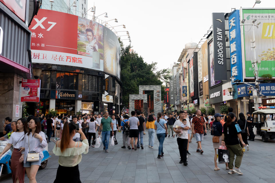 Guangzhou, China - October 20, 2019: Shopping street in Guangzhou - Beijing Lu. People walk in the daytime.