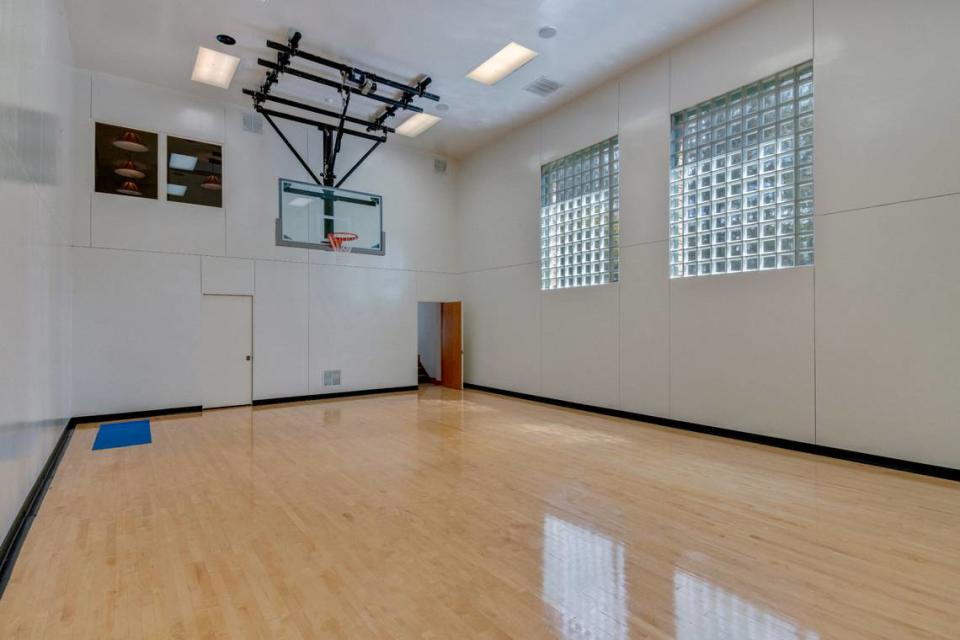 The indoor basketball court at a $4.9 million log home for sale in South Carolina.