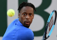 France's Gael Monfils eyes the ball as he returns the ball to Japan's Taro Daniel during their men's singles first round match on day three of The Roland Garros 2019 French Open tennis tournament in Paris on May 28, 2019. (Photo by Philippe Lopez/AFP/Getty Images)