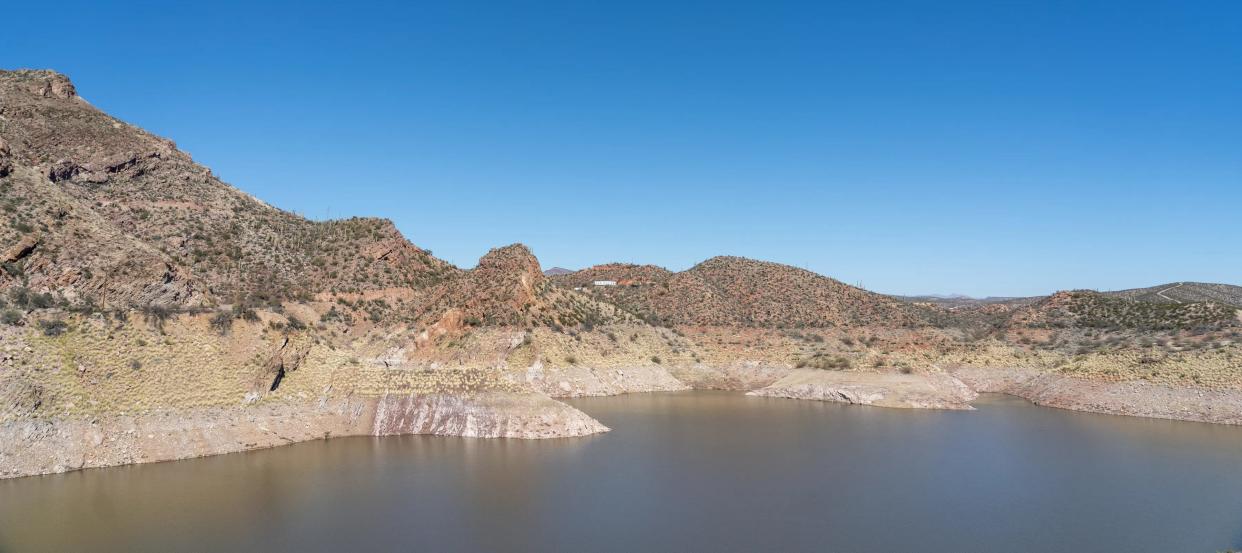 A high-water mark is visible on the Gila River's banks as it reaches the Coolidge Dam, located south of Peridot on the San Carlos Apache Reservation, on February 5, 2022.