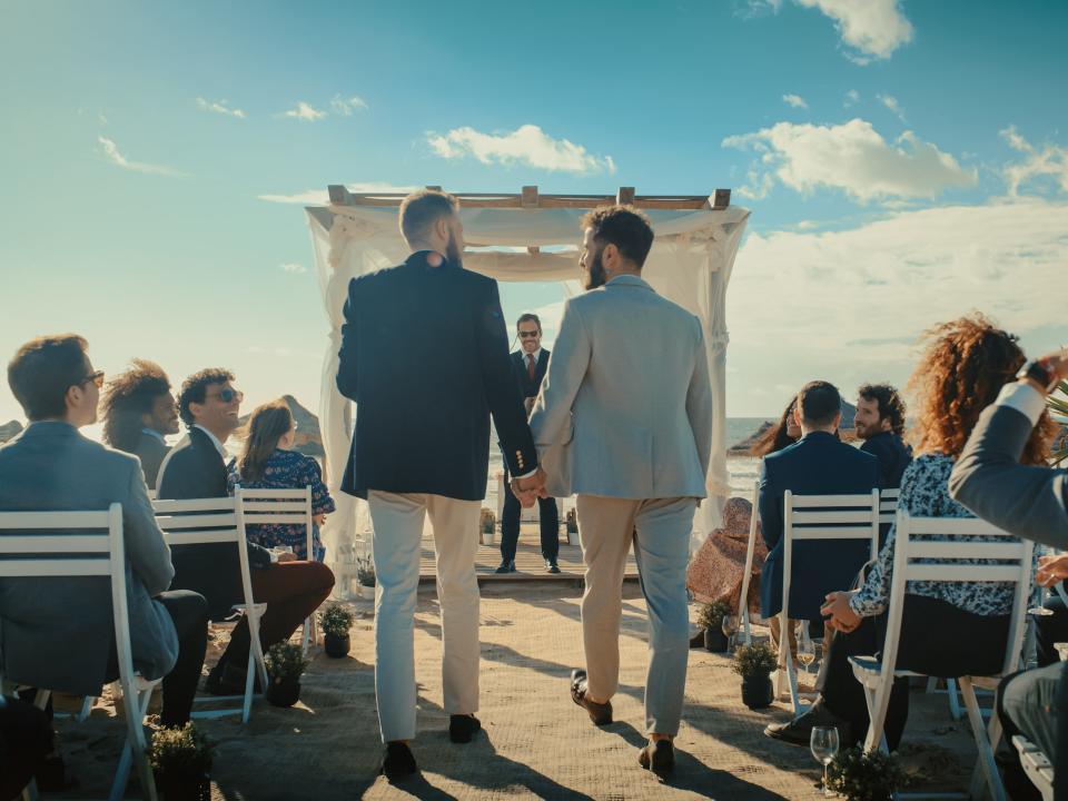 Couple walking down the aisle together.