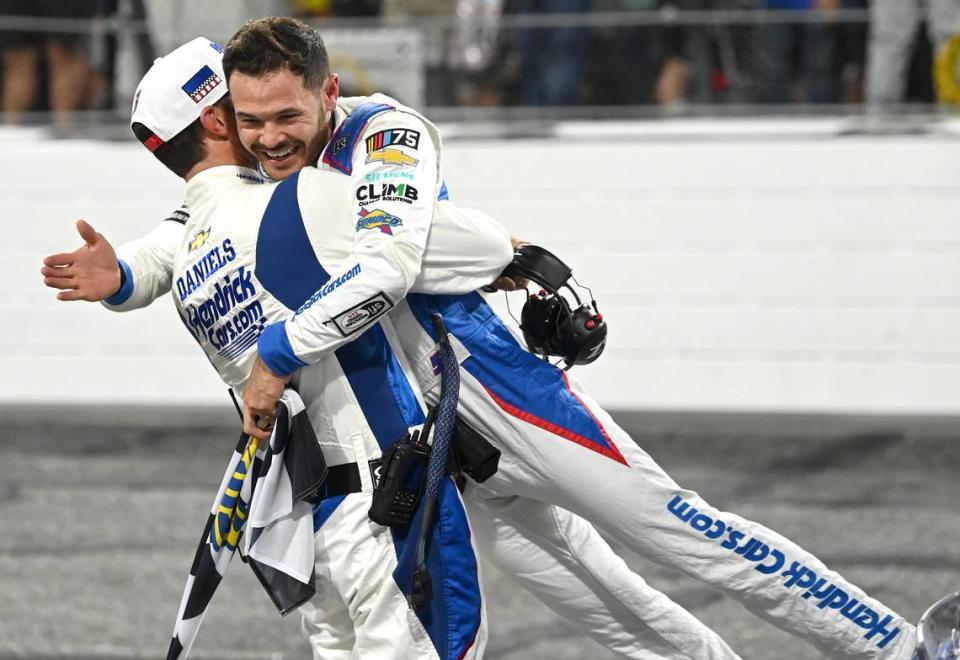 NASCAR crew chief Cliff Daniels, left, lifts driver Kyle Larson into the air as they celebrate winning the NASCAR All-Star race at North Wilkesboro Speedway on Sunday, May 21, 2023.