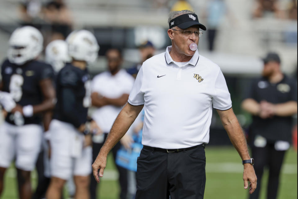 Central Florida head coach Gus Malzahn watches his team before an NCAA college football game against West Virginia, Saturday, Oct. 28, 2023, in Orlando, Fla. (AP Photo/Kevin Kolczynski)