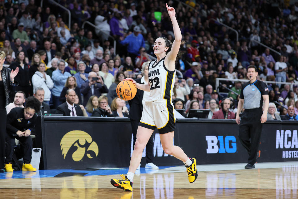 Caitlin Clark in mid-action shot during a game