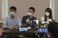 Pro-democracy activists, from left; Joshua Wong, Nathan Law and Agnes Chow attend a press conference in Hong Kong, Saturday, May 30, 2020. President Donald Trump has announced a series of measures aimed at China as a rift between the two countries grows. He said Friday that he would withdraw funding from the World Health Organization, end Hong Kong's special trade status and suspend visas of Chinese graduate students suspected of conducting research on behalf of their government. (AP Photo/Kin Cheung)