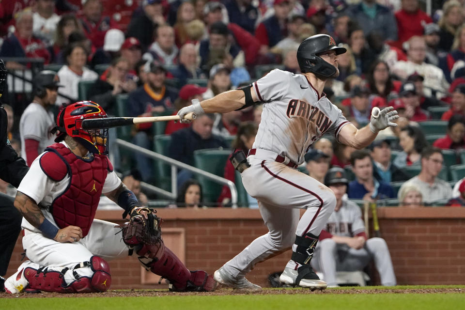 Arizona Diamondbacks' Cooper Hummel watches his RBI single during the sixth inning of a baseball game against the St. Louis Cardinals Friday, April 29, 2022, in St. Louis. (AP Photo/Jeff Roberson)