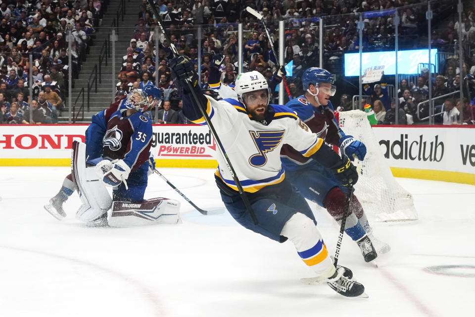 St. Louis Blues left wing David Perron (57) celebrates a goal against Colorado Avalanche goaltender Darcy Kuemper (35) during the third period in Game 2 of an NHL hockey Stanley Cup second-round playoff series Thursday, May 19, 2022, in Denver. The Blues won 4-1. (AP Photo/Jack Dempsey)