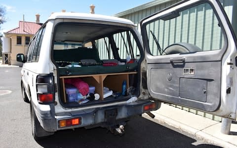 A four-wheel drive vehicle is parked at the police station in Roma, Australia - Credit: AP