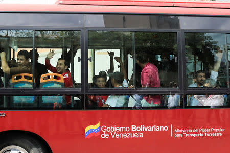 A group of opposition activists jailed for protesting against President Nicolas Maduro arrive on a bus to a detention centre of the Bolivarian National Intelligence Service (SEBIN) in Caracas, Venezuela June 1, 2018. REUTERS/Marco Bello