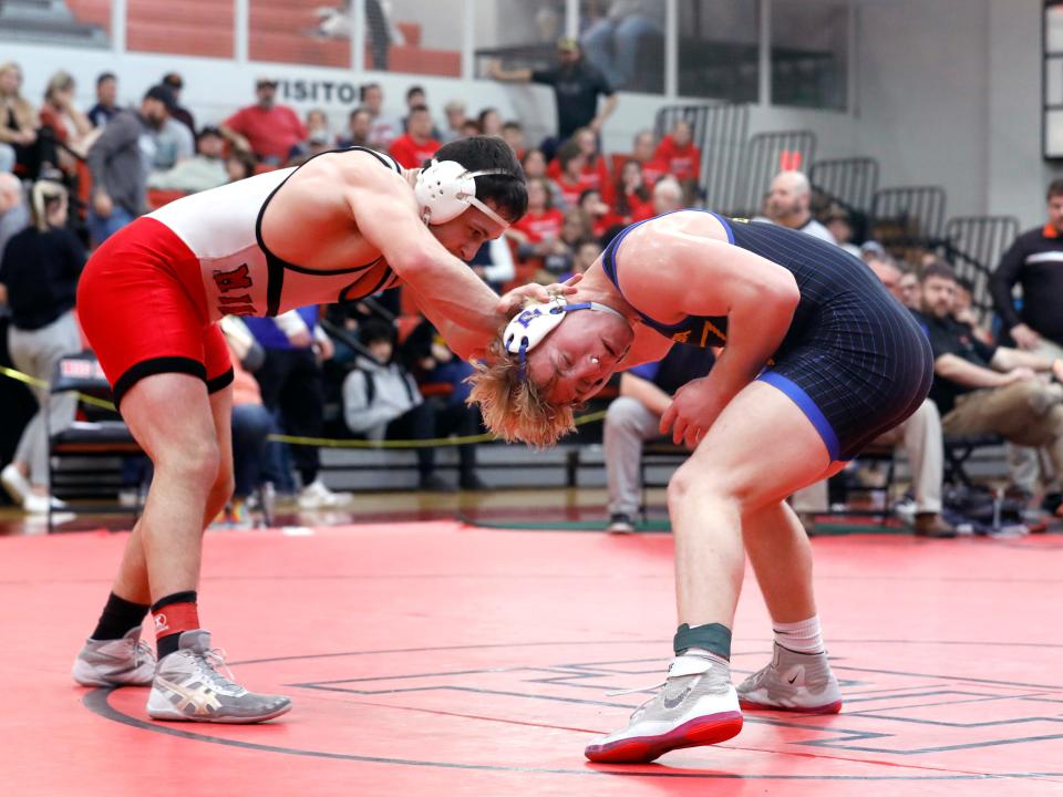 Philo's Drew Lincicome wrestles Minerva's Kaiden Haines, left, in the finals at 190 pounds during the Division II district tournament on Saturday at Steubenville High School. Lincicome, now 49-1, earned a third-period takedown to win by a 3-1 decision, his second against the third-ranked Haines in two weeks.