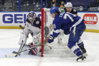 Columbus Blue Jackets goaltender Elvis Merzlikins makes a save against Tampa Bay Lightning's Anthony Cirelli during the second period of an NHL hockey game Thursday, April 22, 2021, in Tampa, Fla. (AP Photo/Mike Carlson)