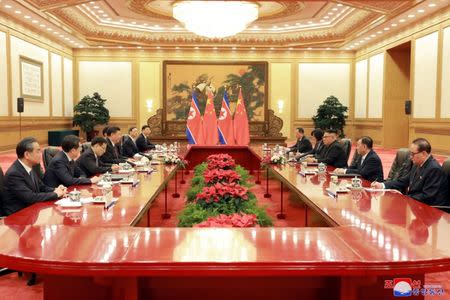 North Korean leader Kim Jong Un and Chinese President Xi Jinping attend a meeting in Beijing, China, in this undated photo released June 20, 2018 by North Korea's Korean Central News Agency. KCNA via REUTERS