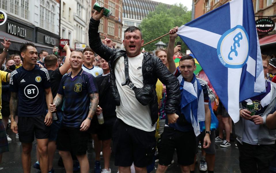 Scotland fans soaked to the skin in Leicester Square - PA