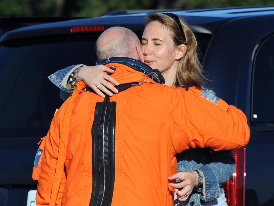 mMark Kelly gets a hug from Gabrielle Giffords before boarding a training aircraft at Kennedy Space Center in 2008.