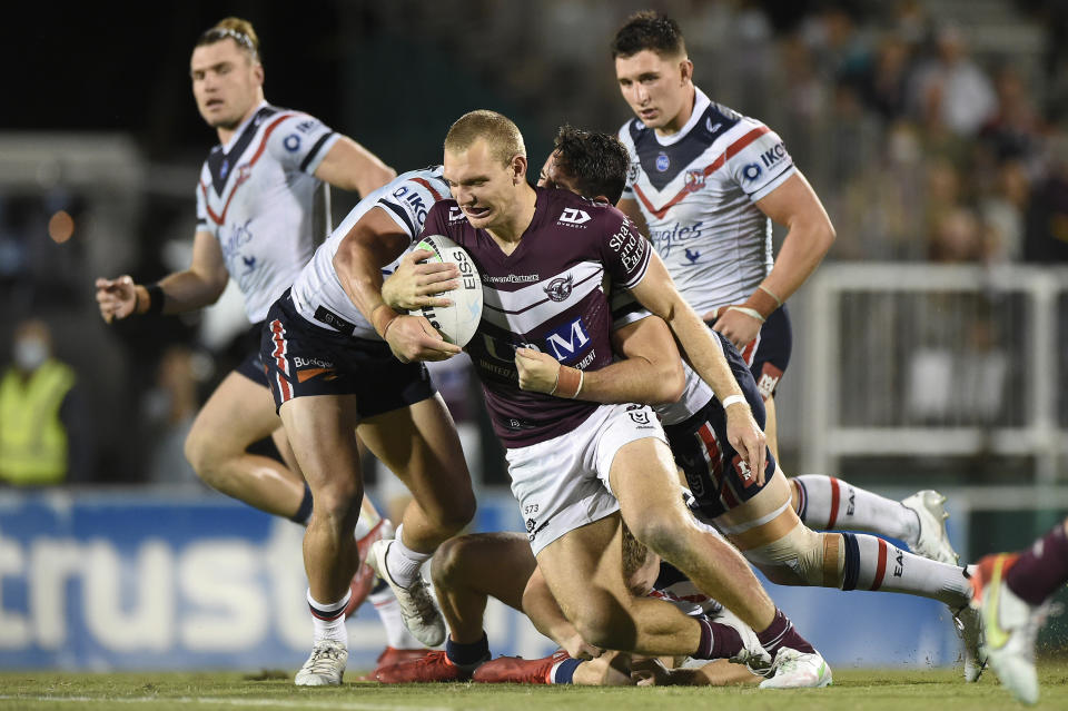 Manly's Tom Trbojevic is tackled during the NRL Semi-Final match against the Sydney Roosters.