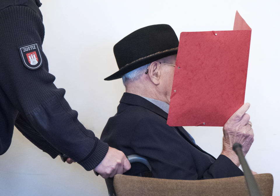 93-year-old former SS guard Bruno Dey in the concentration camp Stutthof near Danzig is sitting in the regional court in Hamburg, Germany, Oct.17, 2019. The prosecution accuses the 93-year-old man of aiding and abetting the murder of 5230 people. The defendant was only 17 or 18 years old at the time of the crime. That's why the trial takes place in front of a juvenile delinquency chamber. About 25 survivors of the concentration camp appear as joint plaintiffs. (Daniel Bockwoldt/dpa via AP)