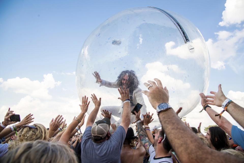 Wayne Coyne of the Flaming Lips photographed in a plastic bubble in 2019, before the pandemic.