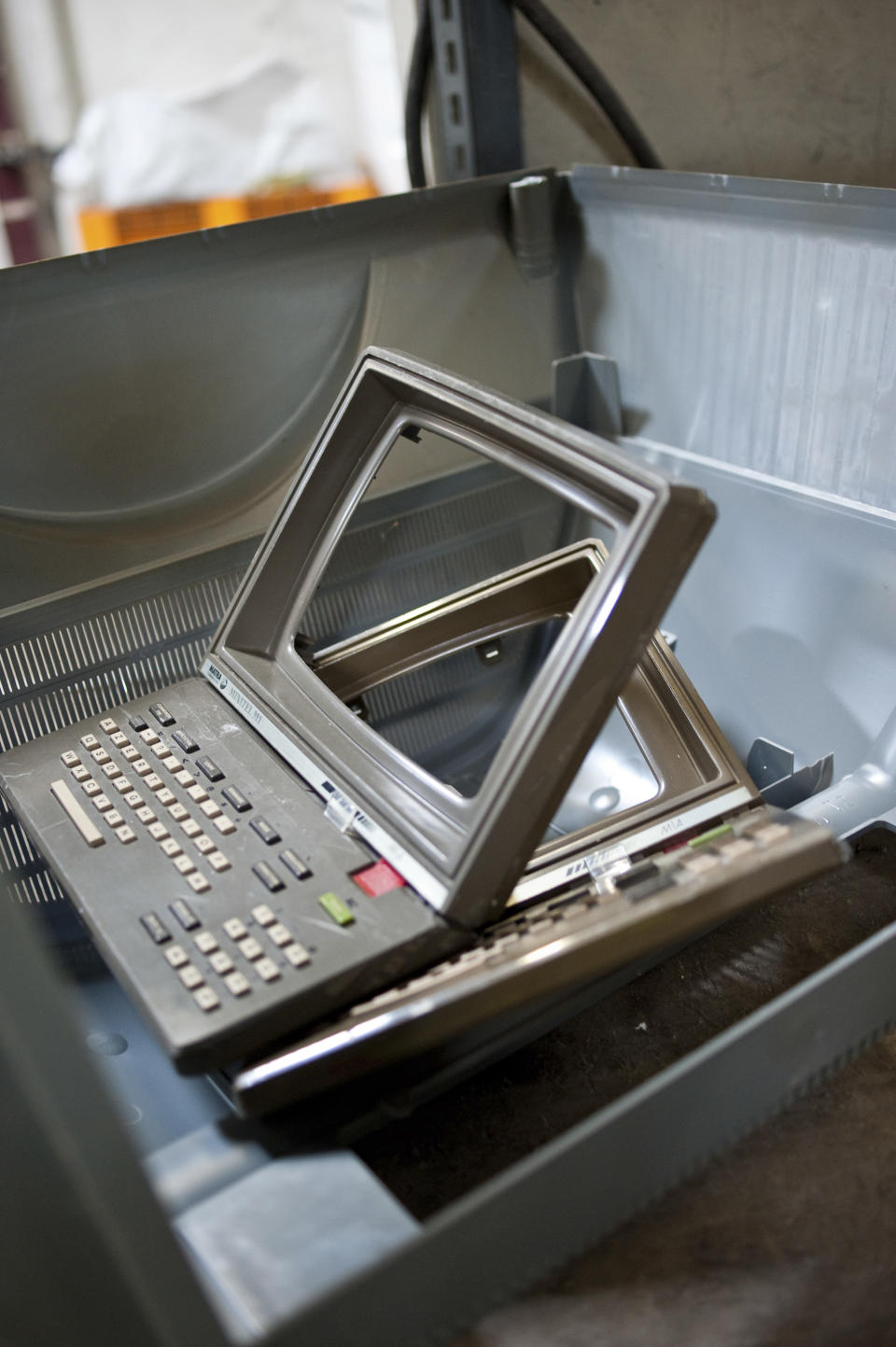 The plastic shell and keyboard of a French Minitel terminal is broken down for recycling in Portet-Sur-Garonne, southwestern France May 23, 2012. The Minitel, the box-like terminal with a keyboard and monochrome screen, was introduced on the market in 1982 by telecommunications operator France Telecom and used by the French to get information as a phone directory or to purchase train tickets. Although there are between 600,000 - 700,000 of the units still in use, the Minitel service will end on June 30, 2012.    REUTERS/Bruno Martin   (FRANCE - Tags: SCIENCE TECHNOLOGY ENVIRONMENT)