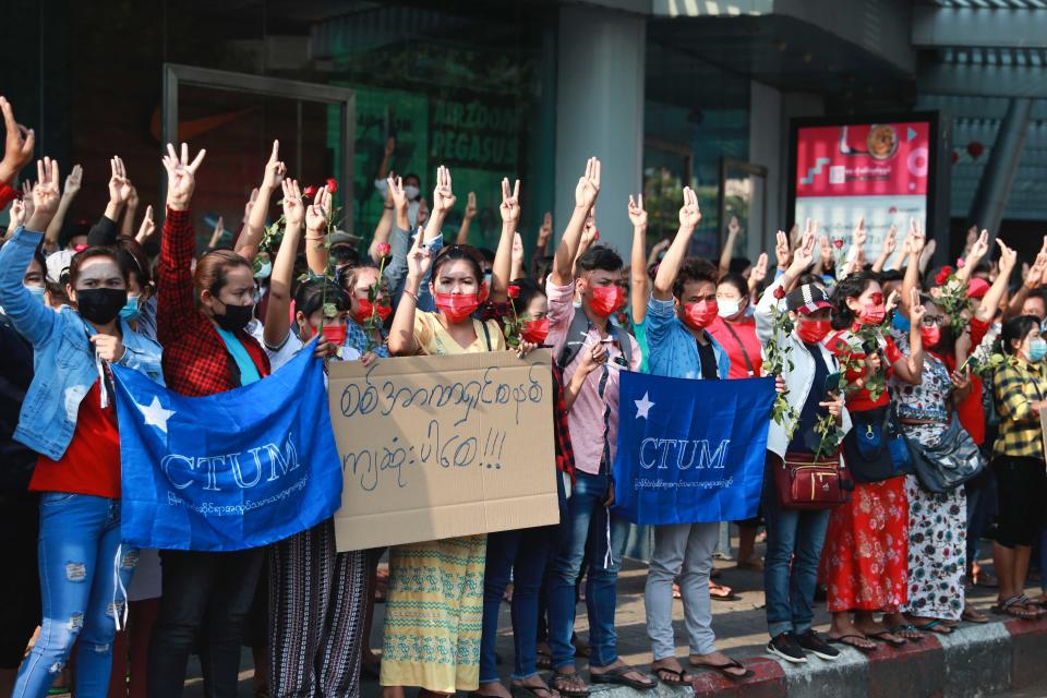 Protesters flash the three-fingered salute in Yangon, Myanmar on Sunday, Feb. 7, 2021. Thousands of people rallied against the military takeover in Myanmar's biggest city on Sunday and demanded the release of Aung San Suu Kyi, whose elected government was toppled by the army that also imposed an internet blackout. (AP Photo)