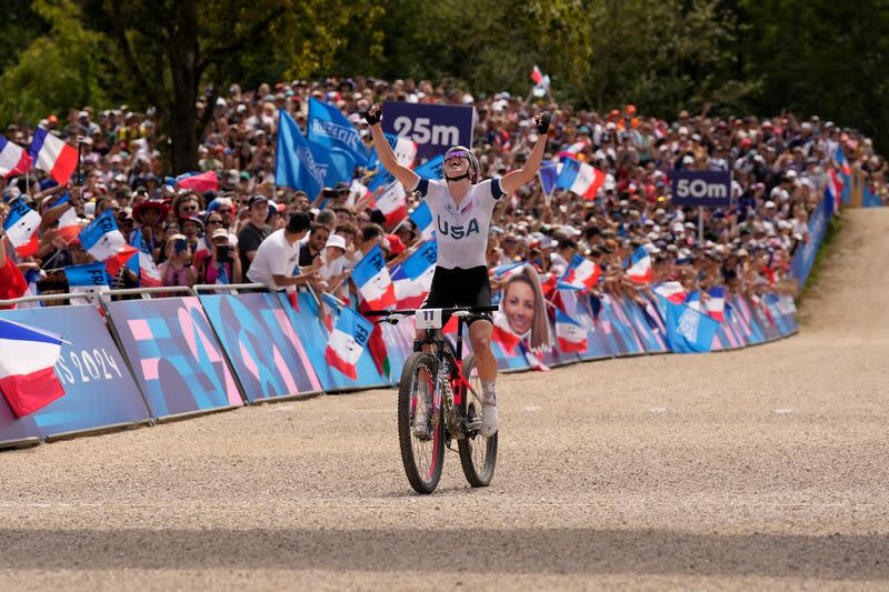 Haley Batten, of United States, celebrates her second place in the women's mountain bike cycling event, at the 2024 Summer Olympics, Sunday, July 28, 2024, in Elancourt, France. | George Walker IV