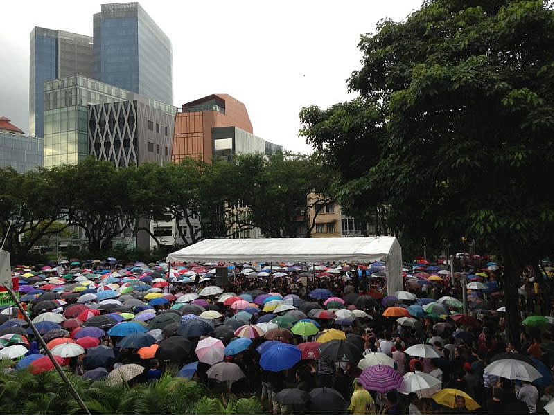 <p>A colourful sea of umbrellas used to combat the persistent drizzle.</p>