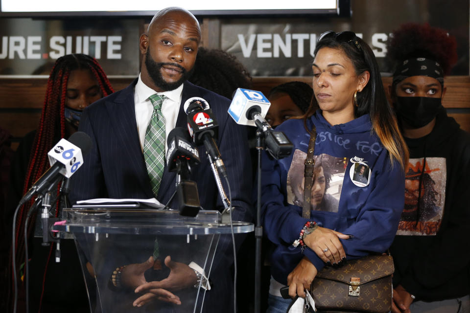 Sean Walton, left, attorney representing Tamala Payne, right, the mother of Casey Goodson Jr., speaks during a news conference Thursday, Dec. 2, 2021, in Columbus, Ohio about the indictment of a former deputy who shot and killed her son. Jason Mead, the Ohio sheriff's deputy who fatally shot Casey Goodson Jr. in the back five times has been charged with murder and reckless homicide. (AP Photo/Jay LaPrete)