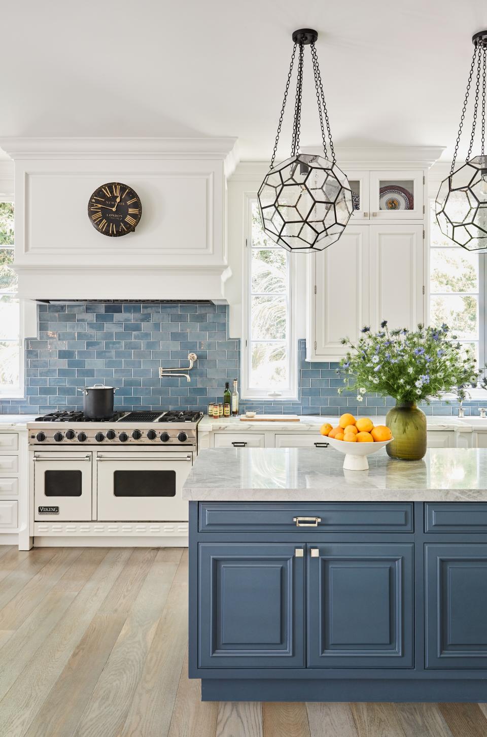 “I am a terrible cook, but yet I love a beautiful kitchen,” says Melissa Rivers, who tapped designer Martyn Lawrence Bullard to oversee the top-down redesign of her Mediterranean-style home in Santa Monica, California. The original kitchen just needed a pick-me-up. The high-end appliances were in great shape, so Rivers decided to make the room her own by adding blue: a blue backsplash, blue tiles, and blue cabinets. This particular blue relates to a hue found in a Robert Rauschenberg painting that also hangs in the kitchen. “As much as I love a neutral room, the kitchen and the family room just need some color,” she says. “It just wakes things up. In L.A., you just see these kitchens that are all white, all the time.”