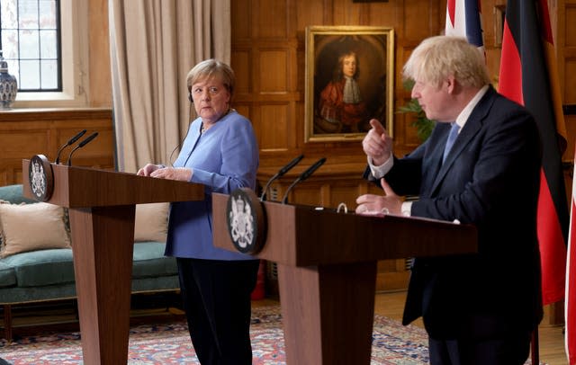 Prime Minister Boris Johnson and the Chancellor of Germany, Angela Merkel, during a press conference after their meeting at Chequers