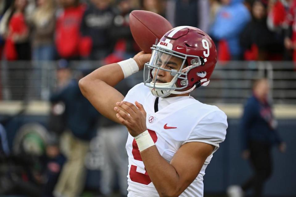 Alabama quarterback Bryce Young (9) warms up on the sidelines during the first half of an NCAA college football game against Mississippi in Oxford, Miss., Saturday, Nov. 12, 2022. (AP Photo/Thomas Graning)