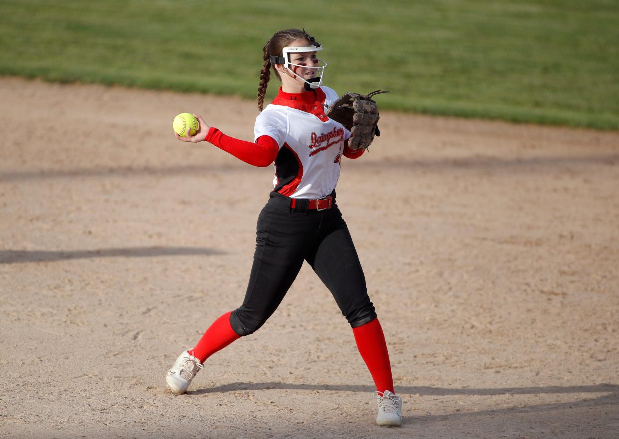 Laingsburg's Bella Latuszek throws a fielded ball to first against DeWitt during the Greater Lansing Area Sports Hall of Fame Softball Classic, Wednesday, May 24, 2023, at Ranney Park.